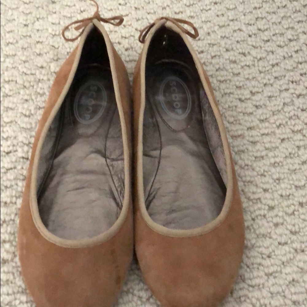 Scoop brown suede slip on shoe . Lace up back